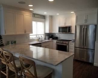 Owner's side kitchen features clean & contemporary updated cabinetry and appliances