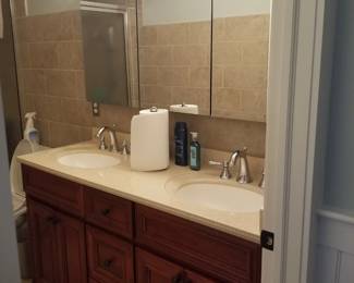 Double bath vanity; mirrored medicine cabinet; vanity lights