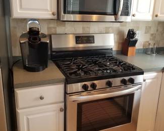 Frigidaire gas range. Frigidaire microwave oven mfg, March 2018. Keurig coffeemaker