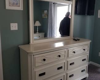 Dresser with mirror matches bed and nightstands