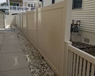 Extensive amount of tan vinyl fencing - nearly new!