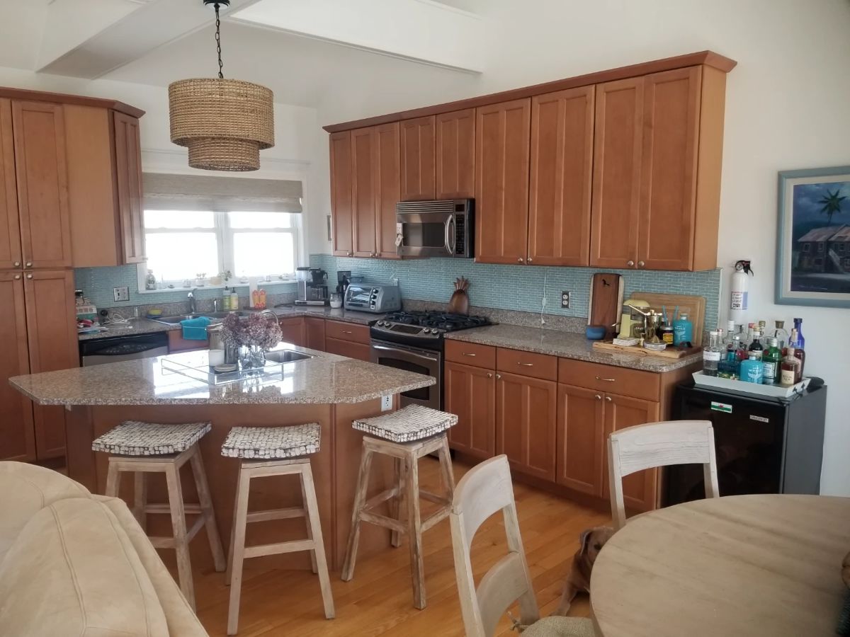 Beautiful kitchen with plenty of cabinets, a pantry and an island
