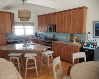 Beautiful kitchen with plenty of cabinets, a pantry and an island