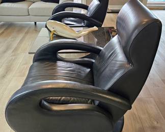 Pair Of Odyssey Black Leather Recliners Designed By Rick Lee.