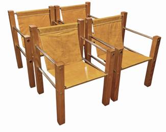 A Set of Four Leather and Chrome Safari Chairs