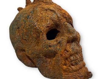 A Grotesque Forged Cast Iron Skull Sculpture