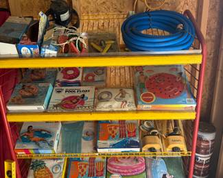 Pool floats still in the box, nice metal shelf, new unused hose