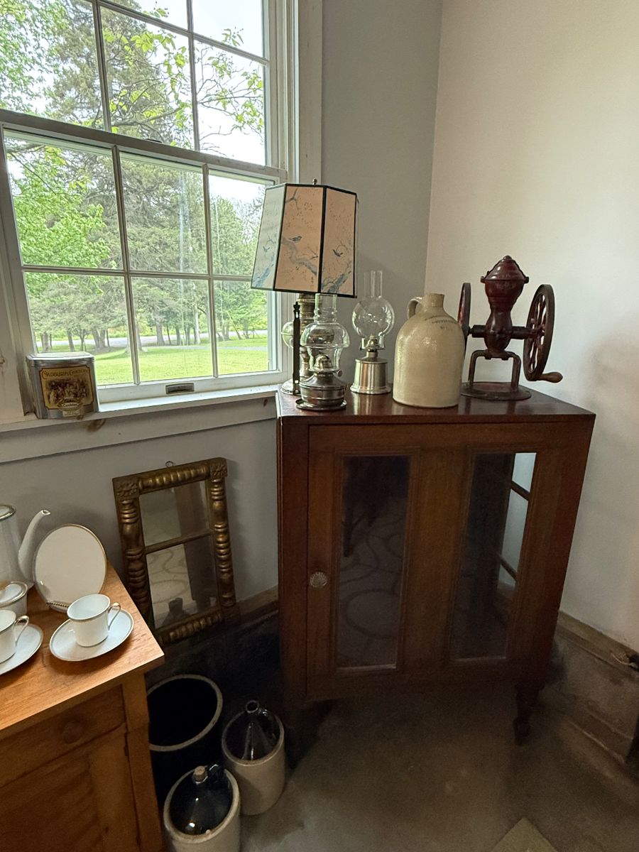 Early pie safe
Stoneware jug
Oil lamps
Coffee grinder
Gold mirror
Stoneware crocks
