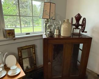 Early pie safe
Stoneware jug
Oil lamps
Coffee grinder
Gold mirror
Stoneware crocks