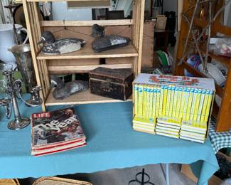 Duck decoys
Nancy Drew book set
Life magazines
Wine rack
Bamboo trays
Movie projector