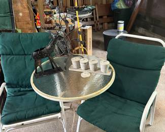 Metal chairs and glass top table
Metal giraffe
Pots
Metal plant stand