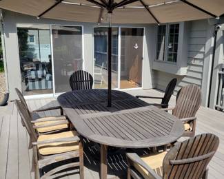 Kingsley Bate 'Hampton" Teak Patio Dining Set with 6 Adirondack Style Chairs with Chair Cushions and Umbrella.