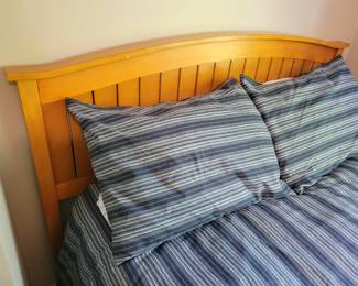 A Full Size Bed. The comforter is not for sale.