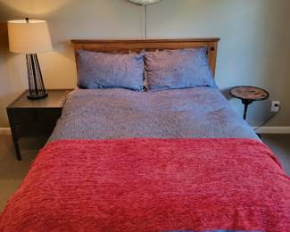 A Full Size Bed with Bedding.