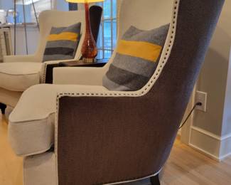 A pair of Modern Nail Head Wingback Armchairs.