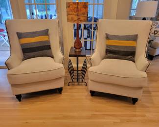 A pair of Modern Nail Head Wingback Armchairs.
