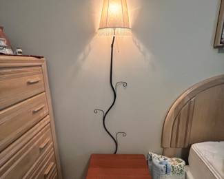 Side table with flower lamp sprouting from it