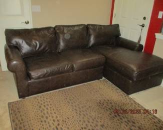 Leather sofa with chaise side