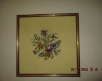 Framed needlepoint work