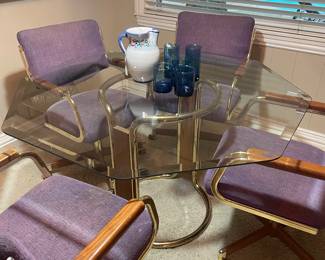 Mid Century Modern Glass top dining table with rolling chairs