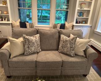 Set of 2 couches with light gray fabric - asking $1000.
These couches are almost brand new and have rarely been sat on. The pickup location is in Ridgewood, NJ. These couches are very comfortable but firm. The fabric is high quality and has a light gray neutral design (see close up photo for fabric). Each couch measures 6'8" long and 3'2" wide. Both ends of each couch have an electronic control that pops up the legs so that you can put your feet up so there are 4 seats in total where you can put your feet up.