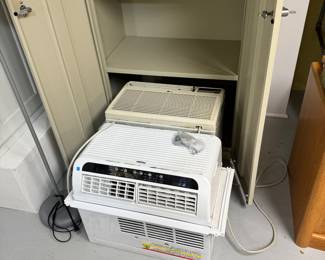 two window, air-conditioning units, metal filing cabinet