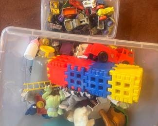 Small metal toys, and a tub of miscellaneous toys to choose from