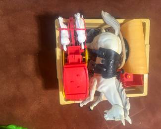 a big horse, carriage with two horses, a covered wagon, and lots of cowboy and Indian Indians