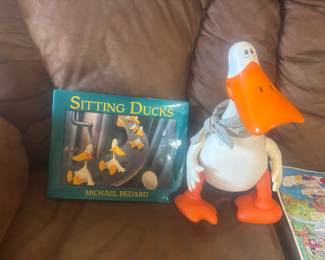 Sitting duck bank w book
