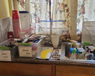 Kitchen Supplies:  Knives, Flatware, Utensils, Cookie Cutters, Cleaners, Paper/Plastic Goods and much.