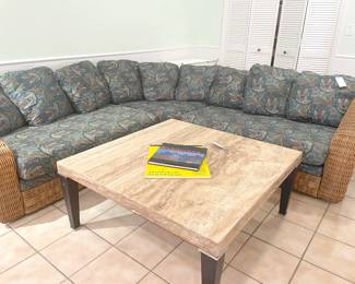 Beautiful marble top coffee table and 3-piece wicker sectional.