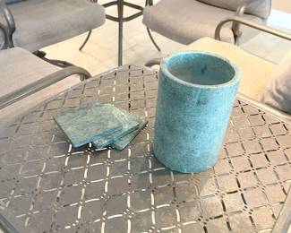 Four outdoor swivel chairs with cushions and 2 matching side tables
