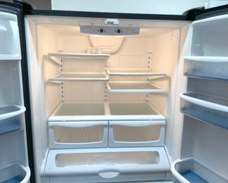 Black Amana French Door refrigerator with freezer below (35.5"W x 31"D x 69"H). Has (untested) icemaker.