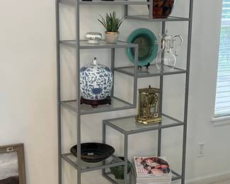 This is a very clean, simple look with glass shelves, silver trim, to add a nice modern look to any room!
