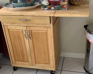 Very nice, handy, portable cart to go anywhere in your home! Great storage! Side comes upright for added space needed!