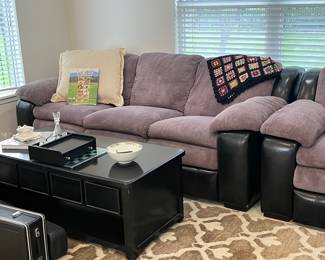 3 piece living room sectional with black leather accents! Very good looking and comfortable! Can be situated several different ways to accommodate your space!