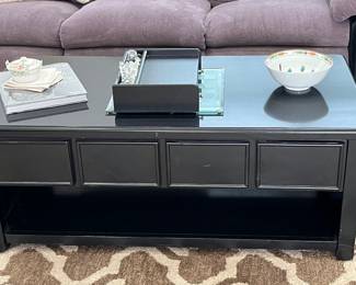 Great black coffee table. Top raises up and extends forward to make eating or reading more comfortable!