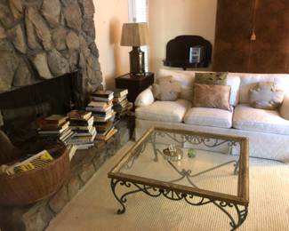 White sofa and glass top coffee table