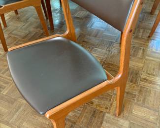 View of the MCM Danish teak wood and leather side dining chairs by Dyrlund - 6 available