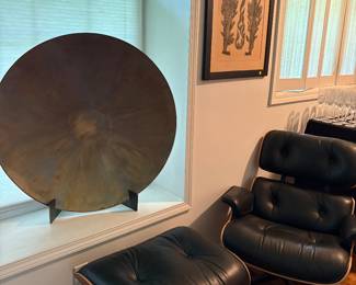 Another view of the Eames chair and ottoman, and copper round dish and metal stand, Chinese print in the background