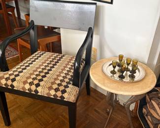 Wood armchair (black) with upholstered seat, and aluminum and marble table. Table has monoped feet, and shown with silver-plated tray and blown glass glasses