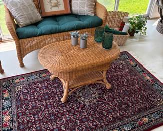 Wicker loveseat and cocktail table, with 100% wool area rug