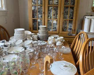 Table with eight chairs, china cabinet, dishes