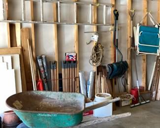 Wheelbarrow, saw horse legs, wood scraps, shovels