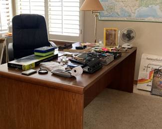 Home Office Desk, lots of office supplies, large US map