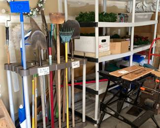 Tool rack and various garden tools and household cleaning items