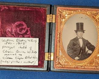 A young Watson E Wilcox in a beautiful ebonized wood case with beehive.