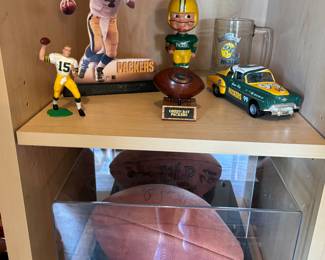 Signed football in case