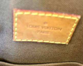 Louis Vuitton label  in satchel handbag