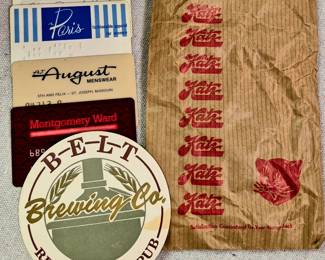 "Katz" Drug Store sack, "Belt Brewing Co." and "MontgomeryWard", "A. J. August", "The Paris" and "Hirsch's" credit cards